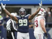 Seattle Seahawks defensive end Leonard Williams (99) celebrates a sack during an NFL football game against the Arizona Cardinals, Sunday, Nov. 24, 2024, in Seattle.