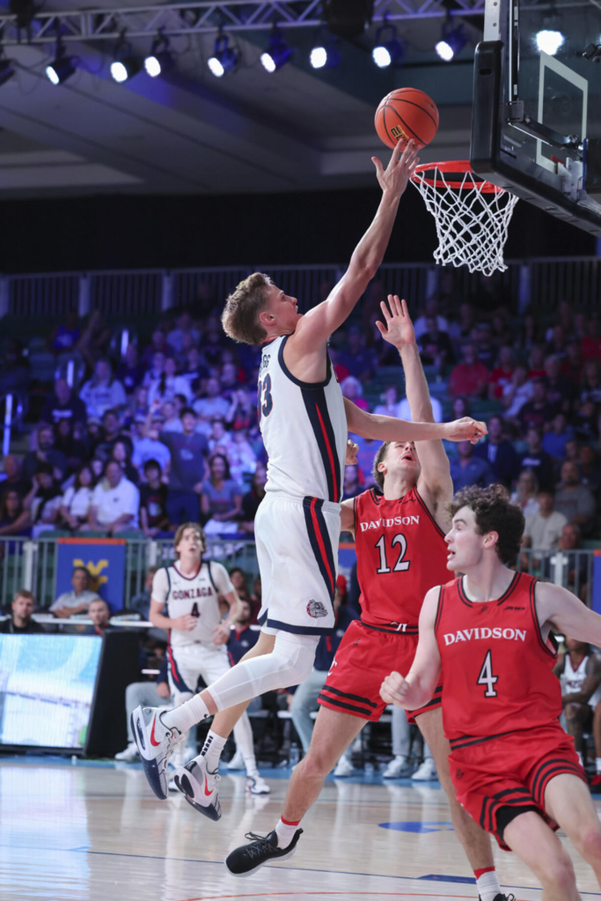 In this photo provided by Bahamas Visual Services, Gonzaga's Ben Gregg (33) goes to the basket during an NCAA college basketball game against Davidson, Friday, Nov. 29, 2024, in Paradise Island, Bahamas.