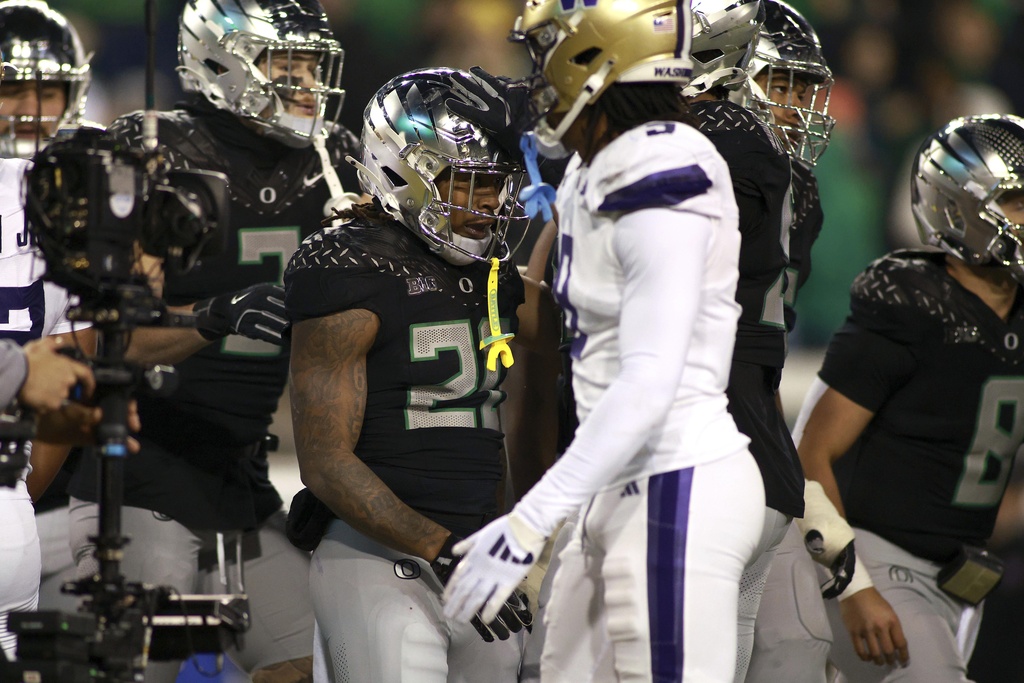 Oregon running back Jordan James is congratulated on a score during an NCAA college football game against Washington, Saturday, Nov. 30, 2024, in Eugene, Ore.