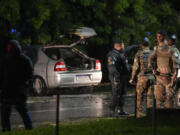 Police inspect a vehicle outside the Supreme Court in Bras&iacute;lia, Brazil, following an explosion, Wednesday, Nov. 13, 2024.