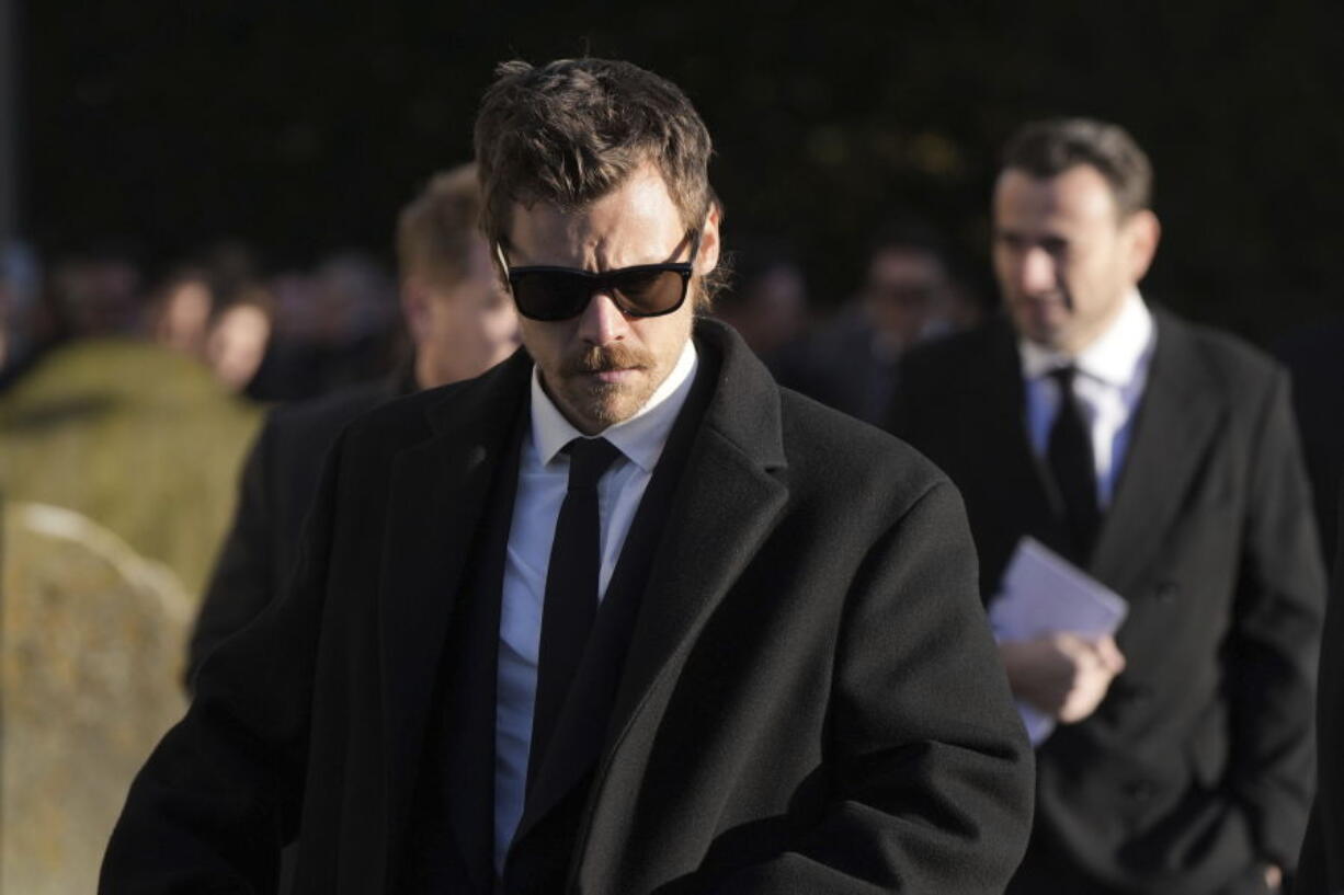 Harry Styles walks after the funeral service of One Direction singer Liam Payne at St Mary&#039;s Church in Amersham, England, Wednesday, Nov. 20, 2024.