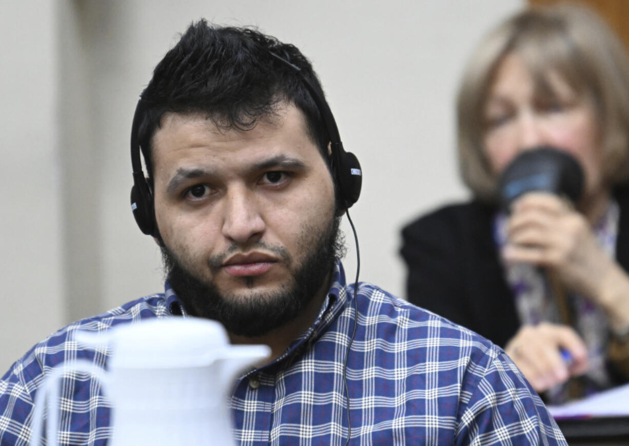 Jose Ibarra, accused of killing a Georgia nursing student earlier this year, listens through an interpreter during his trial at Athens-Clarke County Superior Court, Friday, Nov. 15, 2024, in Athens, Ga.