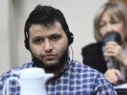 Jose Ibarra, accused of killing a Georgia nursing student earlier this year, listens through an interpreter during his trial at Athens-Clarke County Superior Court, Friday, Nov. 15, 2024, in Athens, Ga.