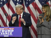 Republican Presidential nominee former President Donald Trump dances as former first lady Melania Trump watches at the Palm Beach County Convention Center during an election night watch party, Wednesday, Nov. 6, 2024, in West Palm Beach, Fla.