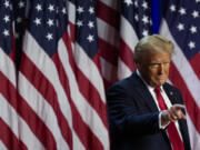 Republican presidential nominee former President Donald Trump points to the crowd at an election night watch party, Wednesday, Nov. 6, 2024, in West Palm Beach, Fla.