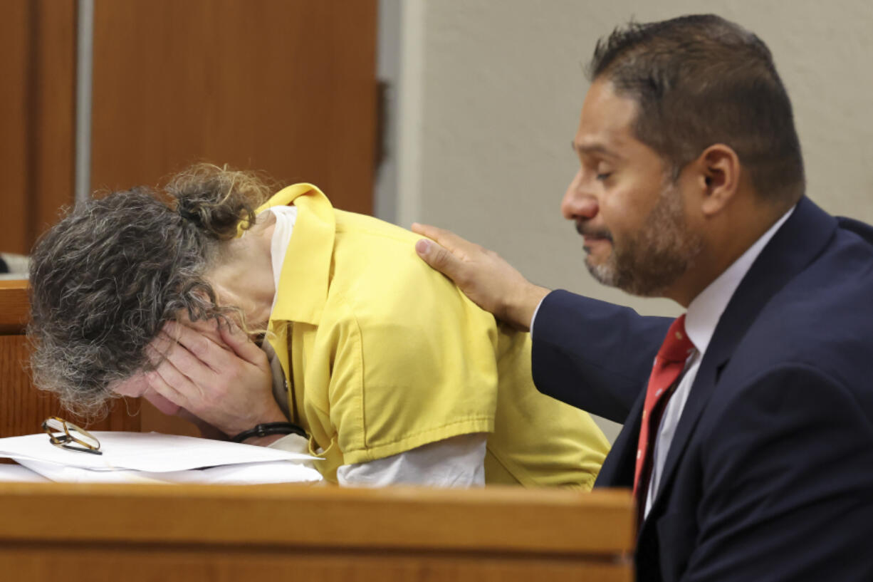 Defendant Susan Lorincz, left, who fatally shot a Black neighbor through her front door during an ongoing dispute, weeps during her sentencing hearing Monday, Nov. 25, 2024, in Ocala, Fla.