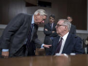 Senate Judiciary Committee Chairman Dick Durbin, D-Ill., seated at right, confers with Sen. Lindsey Graham, R-S.C., left, the ranking member, as the panel convenes to confirm President Joe Biden&rsquo;s nominees in the closing weeks of the 118th Congress and before Donald Trump takes office, at the Capitol in Washington, Thursday, Nov. 14, 2024. (AP Photo/J.