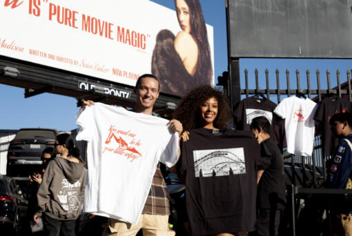 Van Tillian, left and Kapri Matlock pose for a photo with tee-shirts they got at a Pop-Up merchandise event for the movie Anora on Saturday, Nov. 9, 2024 in Los Angeles.