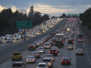 FILE - Evening rush hour traffic fills Highway 50, Jan. 26, 2017, in Sacramento, Calif.