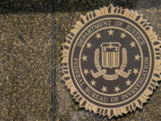 FILE - The seal on the J. Edgar Hoover FBI Building is seen June 9, 2023, in Washington.