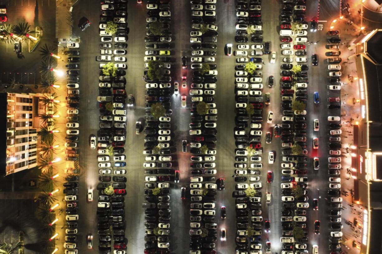 An aerial view shows a packed parking lot at Citadel Outlets in Commerce, Calif., Thursday, Nov. 28, 2024, as early Black Friday shoppers arrive at the mall. (AP Photo/Jae C.