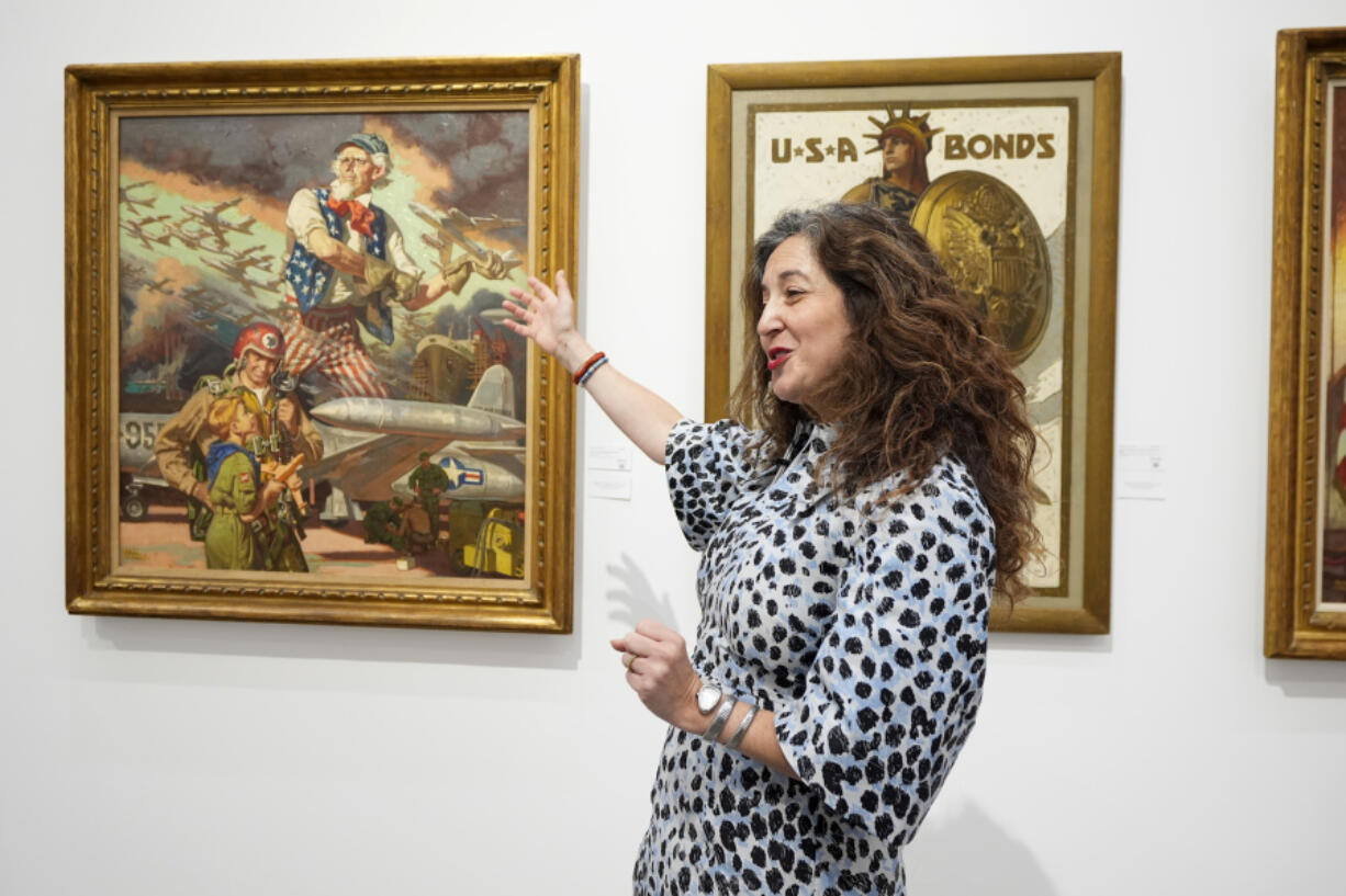 Aviva Lehmann, Heritage Auction&rsquo;s senior vice president of American art, responds to a question Oct. 17 as she stands by paintings that are some of many works from the Boy Scouts of America&rsquo;s art collection &mdash; including some paintings by Norman Rockwell &mdash; that will go up for auction this month to help compensate tens of thousands of people, mainly men, who were sexually abused while in scouting in Dallas.