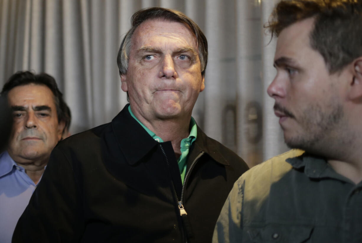 FILE - Brazil&#039;s former President Jair Bolsonaro prepares to speak to the press in Belo Horizonte, Brazil, June 30, 2023, the day that judges ruled him ineligible to run for political office until 2030 after concluding that he abused his power and cast unfounded doubts on the country&#039;s electronic voting system.