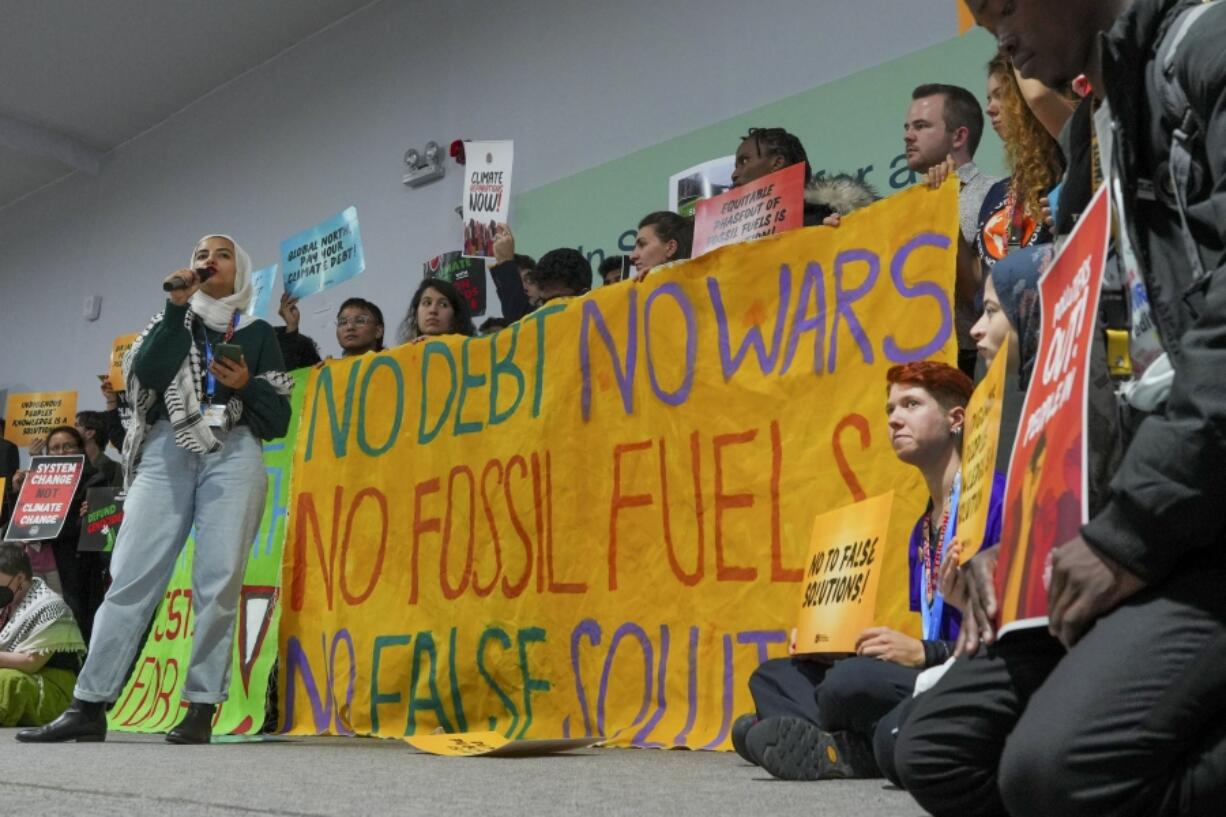 Activists participate in a demonstration against wars and fossil fuels at the COP29 U.N. Climate Summit, Friday, Nov. 15, 2024, in Baku, Azerbaijan.