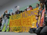 Activists participate in a demonstration against wars and fossil fuels at the COP29 U.N. Climate Summit, Friday, Nov. 15, 2024, in Baku, Azerbaijan.