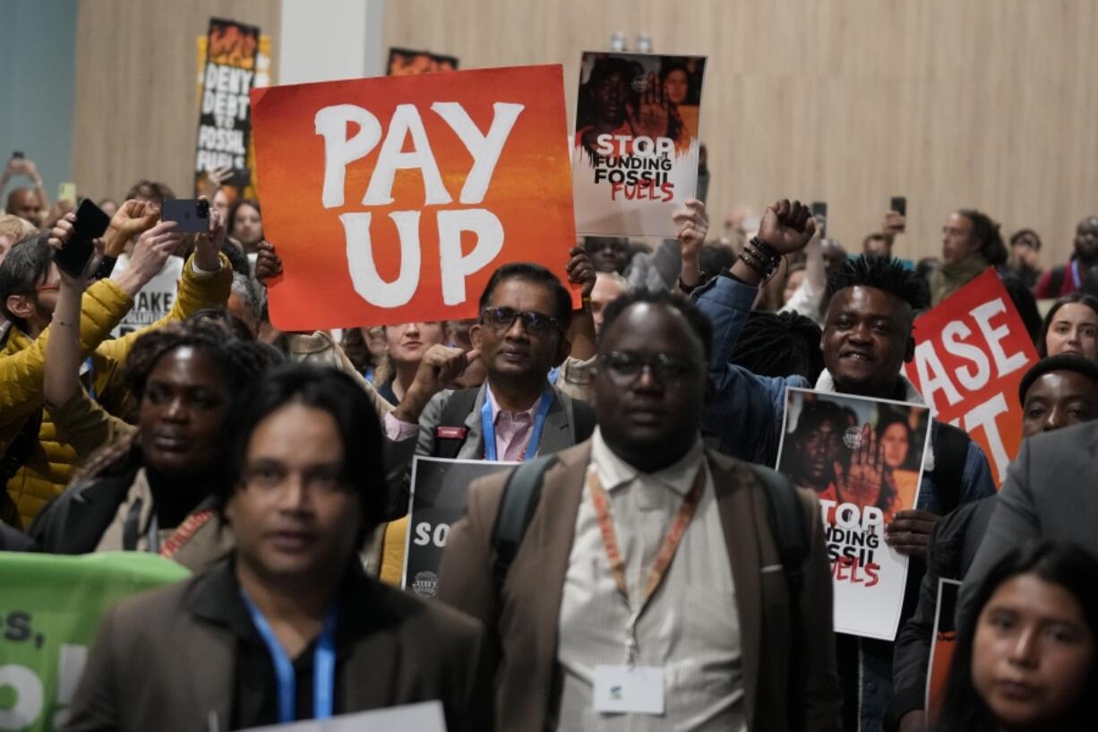 Activists participate in a demonstration for climate finance during the COP29 U.N. Climate Summit, Saturday, Nov. 16, 2024, in Baku, Azerbaijan.