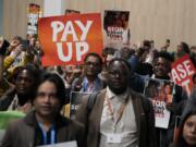 Activists participate in a demonstration for climate finance during the COP29 U.N. Climate Summit, Saturday, Nov. 16, 2024, in Baku, Azerbaijan.