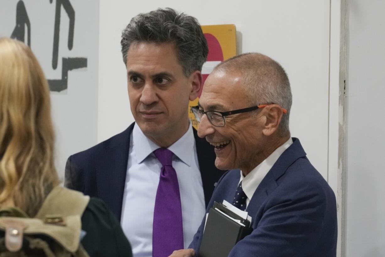 Ed Miliband, United Kingdom energy minister, center, speaks with John Podesta, U.S. climate envoy, right, at the COP29 U.N. Climate Summit, Friday, Nov. 22, 2024, in Baku, Azerbaijan.