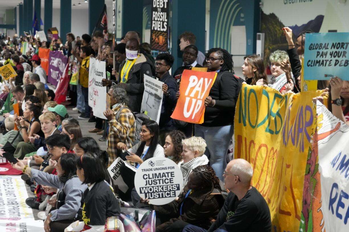 Activists participate in a demonstration at the COP29 U.N. Climate Summit, Saturday, Nov. 16, 2024, in Baku, Azerbaijan.