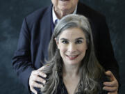 CORRECTS SPELLING OF LAST NAME - FILE - Arthur Frommer, background, poses with his daughter, Pauline, in New York, Jan. 6, 2017.