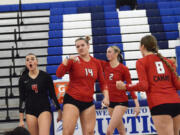 Shaylee Stephen (14) of Camas celebrates a block against Mount Rainier with teammates Emmah Sanchez (4), Ella Thompson (2) and Kendyl Wiest (8) in a Class 4A bi-district volleyball tournament match at Curtis High School in University Place on Friday, Nov. 15, 2024.