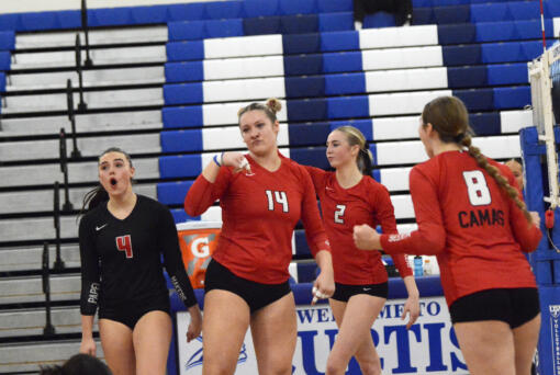 Shaylee Stephen (14) of Camas celebrates a block against Mount Rainier with teammates Emmah Sanchez (4), Ella Thompson (2) and Kendyl Wiest (8) in a Class 4A bi-district volleyball tournament match at Curtis High School in University Place on Friday, Nov. 15, 2024.