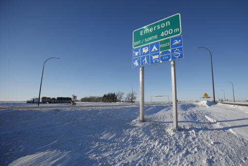 FILE - Road signage is posted just outside of Emerson, Manitoba on Thursday, Jan. 20, 2022.