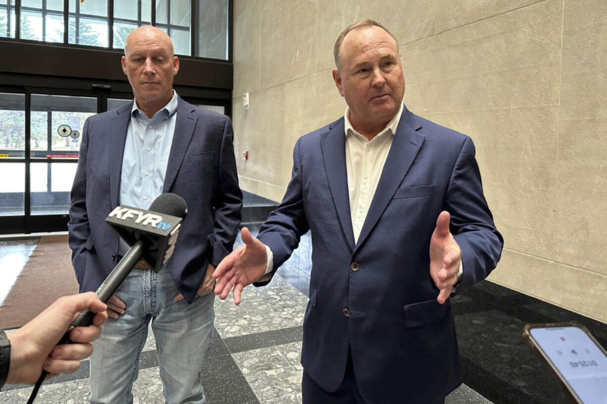 Summit Carbon Solutions CEO Lee Blank, right, talks to reporters, Friday, Nov. 15, 2024, at the state Capitol in Bismarck, N.D., after the state Public Service Commission approved a siting permit for the company&#039;s proposed North Dakota route of its planned five-state Midwest carbon dioxide pipeline. At left is Summit Chief Operating Officer Jimmy Powell.