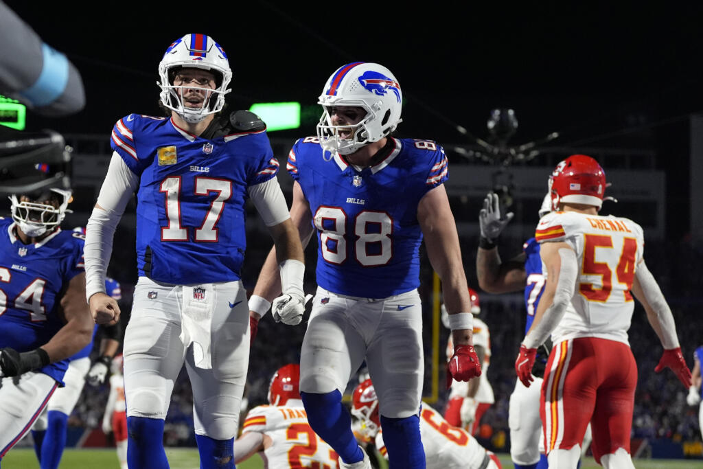 Buffalo Bills quarterback Josh Allen (17) is congratulated by teammate Dawson Knox (88) after scoring on a 26-yard run during the second half of an NFL football game against the Kansas City Chiefs on Nov. 17, 2024, in Orchard Park, N.Y. The Buffalo Bills have called for volunteers to potentially shovel snow at Highmark Stadium, where over 2 feet of snow is possible before Sunday night’s game against the San Francisco 49ers.