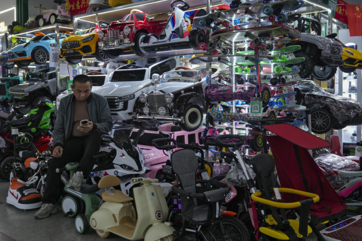 A vendor waits for customers at his store selling electric toy cars at the Yiwu wholesale market in Yiwu, east China&rsquo;s Zhejiang province on Nov. 8, 2024.