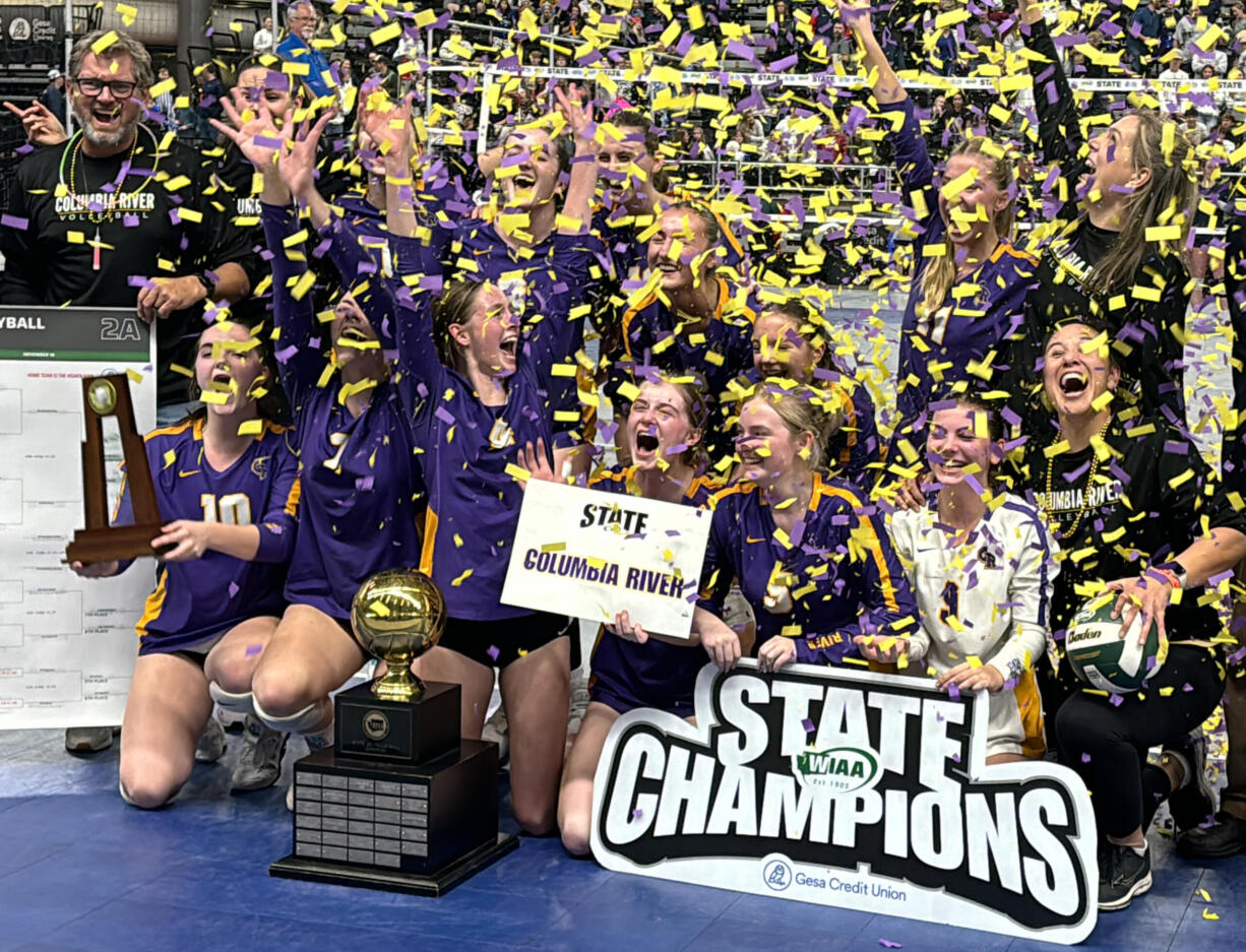 The Columbia River volleyball team celebrates its five-set victory over Ellensburg in the state championship match at the Class 2A state tournament on Saturday, Nov. 16, 2024 in Yakima.