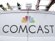 FILE- A Comcast truck is shown on Jan. 24, 2019, in Pittsburgh. (AP Photo/Gene J.