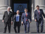 House Republican leaders, from left, Majority Whip Tom Emmer, R-Minn., Majority Leader Steve Scalise, R-La., Speaker of the House Mike Johnson, R-La., and Rep. Richard Hudson, R-N.C., chairman of the National Republican Congressional Committee, arrive to tout Republican wins and meet with reporters on the steps of the Capitol in Washington, Tuesday, Nov. 12, 2024. Congress returns to work this week to begin what is known as a lame-duck session &mdash; that period between Election Day and the end of the two-year congressional term. (AP Photo/J.