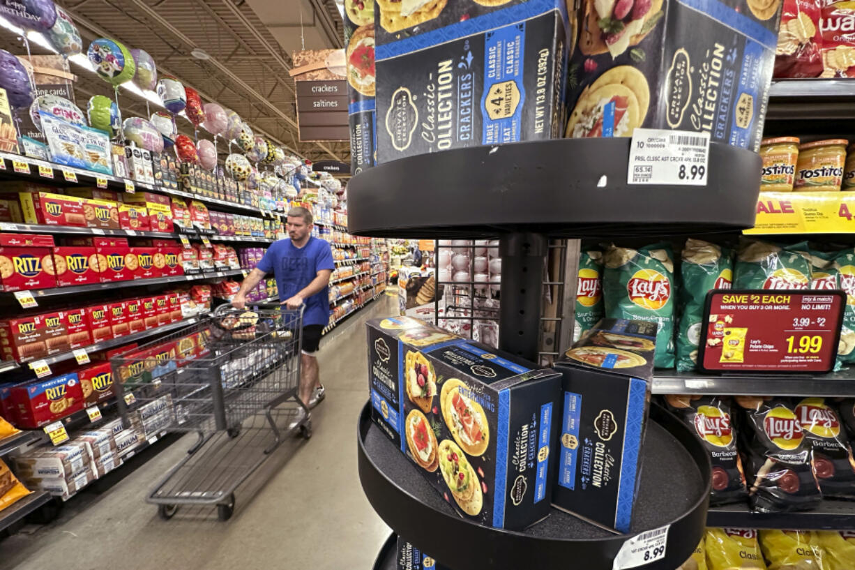 FILE - A customer shops at a grocery store in Chicago, Sept. 19, 2024. (AP Photo/Nam Y.