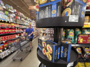 FILE - A customer shops at a grocery store in Chicago, Sept. 19, 2024. (AP Photo/Nam Y.