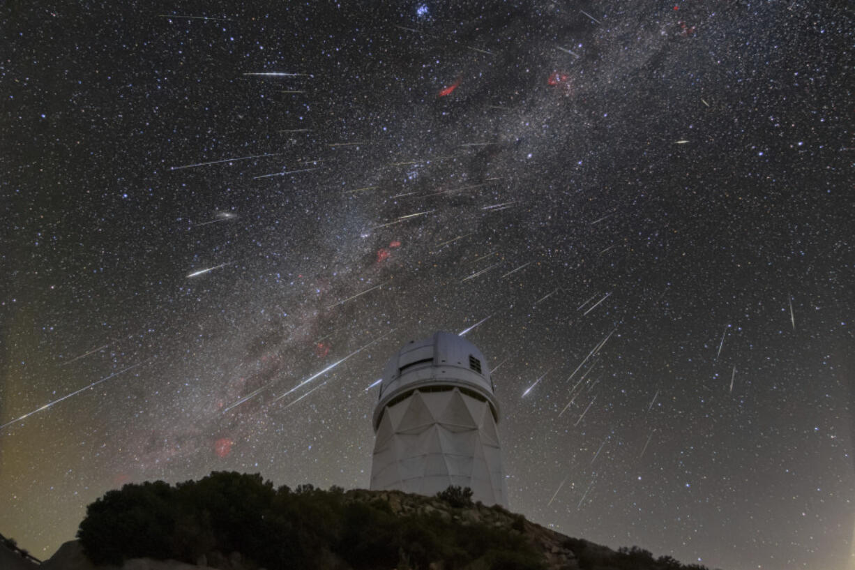 Meteors from the Geminid meteor shower streaking across the sky above the Nicholas U. Mayall Telescope at Kitt Peak National Observatory (KPNO), a Program of NSF&rsquo;s NOIRLab, in Tucson, Ariz.