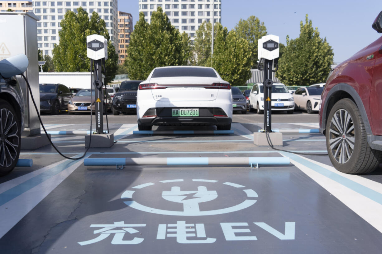 A electric vehicle charging station is seen in Beijing, Friday, Oct. 11, 2024.