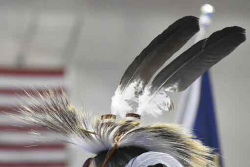 Eagle feathers adorn a headdress during a powwow in Montana, on April 6, 2024.