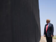 FILE - In this June 23, 2020, file photo, President Donald Trump tours a section of the border wall in San Luis, Ariz.