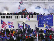 FILE - Rioters storm the West Front of the U.S. Capitol Jan. 6, 2021, in Washington.