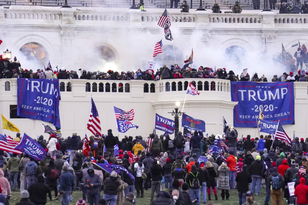 Rioters loyal to President Donald Trump storm the Capitol, Jan. 6, 2021, in Washington.