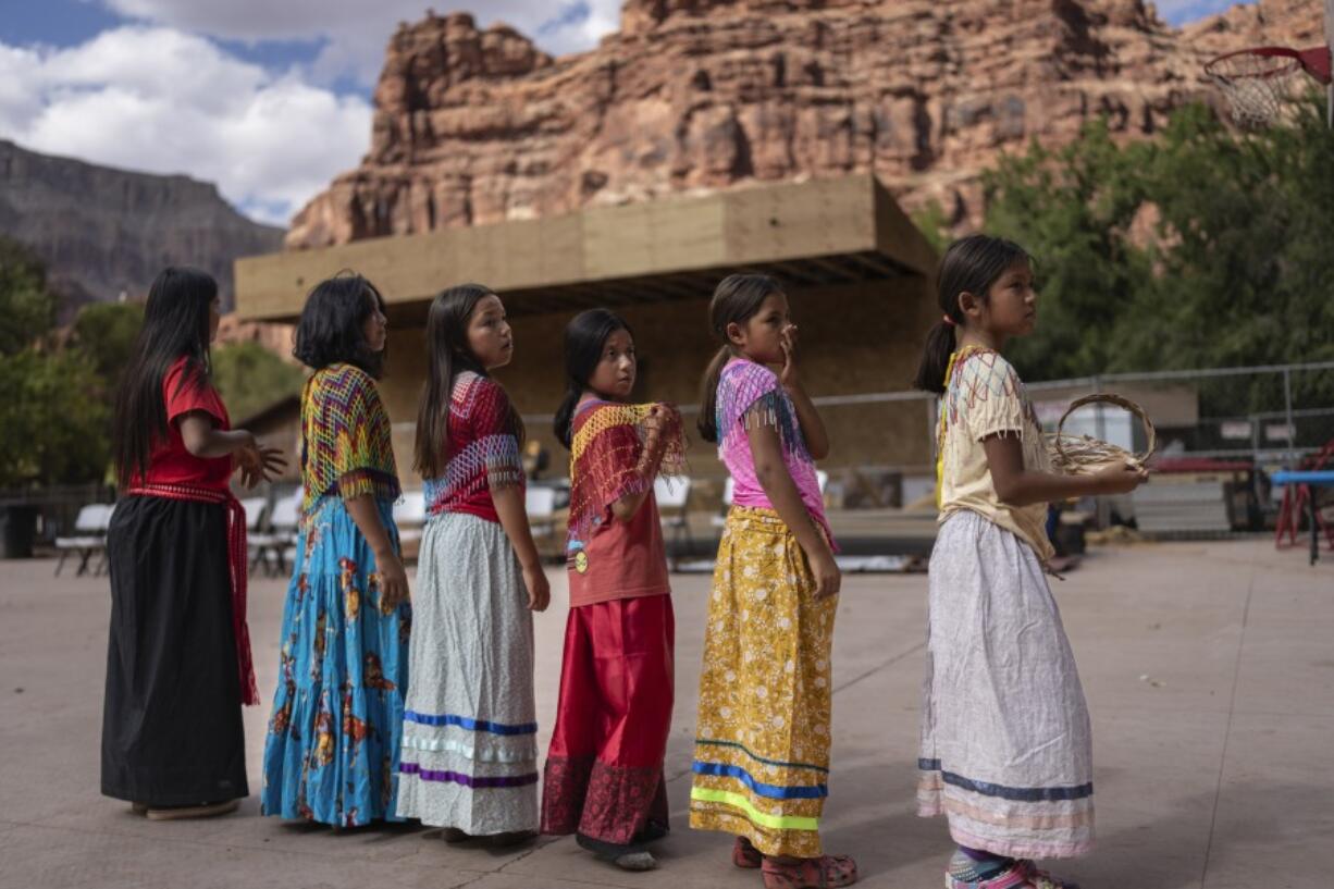 Young Havasupai dancers prepare to perform a traditional dance welcoming Democratic Senate candidate Ruben Gallego, in Supai, Ariz., Monday, Oct. 14, 2024. Gallego hoped to connect with voters in the Havasupai reservation, which has only 156 registered voters, to fulfill a campaign pledge to visit all the Native American tribes in Arizona.