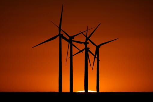 Wind turbines are silhouetted against the setting sun at the Spearville Wind Farm, Sunday, Sept. 29, 2024, near Spearville, Kan.