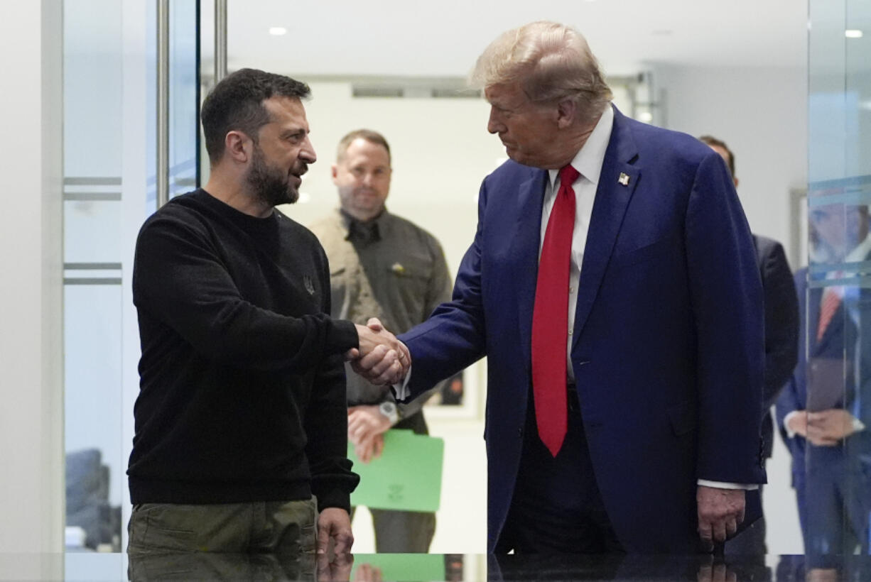 FILE - Republican presidential nominee former President Donald Trump, right, and Ukraine&rsquo;s President Volodymyr Zelenskyy shake hands during their meeting at Trump Tower, on Sept. 27, 2024, in New York.