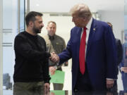 FILE - Republican presidential nominee former President Donald Trump, right, and Ukraine&rsquo;s President Volodymyr Zelenskyy shake hands during their meeting at Trump Tower, on Sept. 27, 2024, in New York.