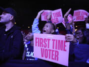 A first-time voter cheers before former first lady Michelle Obama speaks at campaign rally in support of Democratic presidential nominee Vice President Kamala Harris, Tuesday, Oct. 29, 2024, in College Park, Ga.