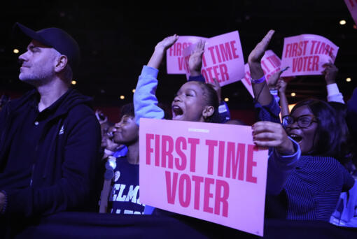 A first-time voter cheers before former first lady Michelle Obama speaks at campaign rally in support of Democratic presidential nominee Vice President Kamala Harris, Tuesday, Oct. 29, 2024, in College Park, Ga.