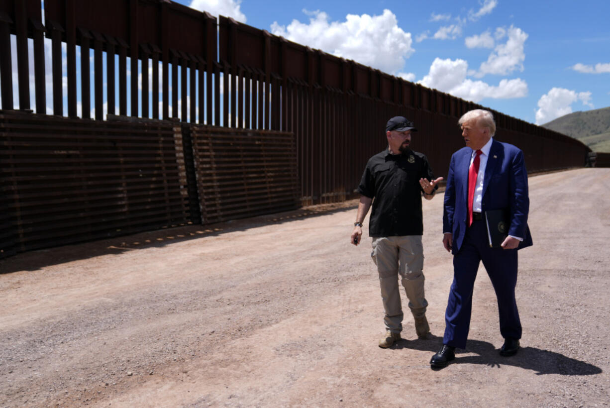 FILE - Republican presidential nominee former President Donald Trump listens to Paul Perez, president of the National Border Patrol Council, as he tours the southern border with Mexico, on Aug. 22, 2024, in Sierra Vista, Ariz.