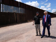 FILE - Republican presidential nominee former President Donald Trump listens to Paul Perez, president of the National Border Patrol Council, as he tours the southern border with Mexico, on Aug. 22, 2024, in Sierra Vista, Ariz.