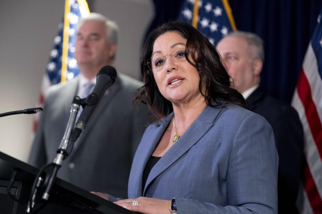 FILE - Rep. Lori Chavez-DeRemer, R-Ore., accompanied by Majority Whip Rep. Tom Emmer, R-Minn., left, and House Majority Leader Rep. Steve Scalise, R-La., right, speaks at a news conference on Capitol Hill in Washington, Wednesday, Jan. 25, 2023.